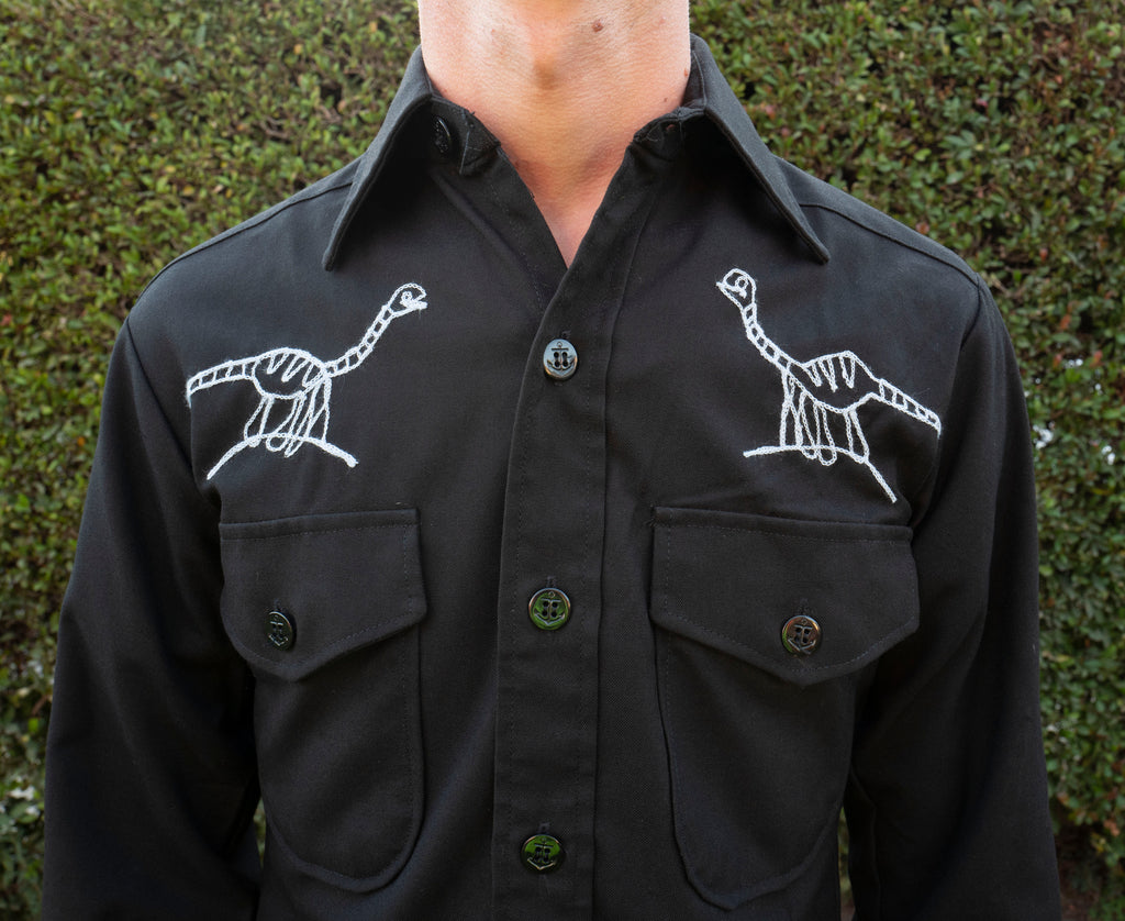 Long sleeve black button up shirt: raptors and spinosaurus