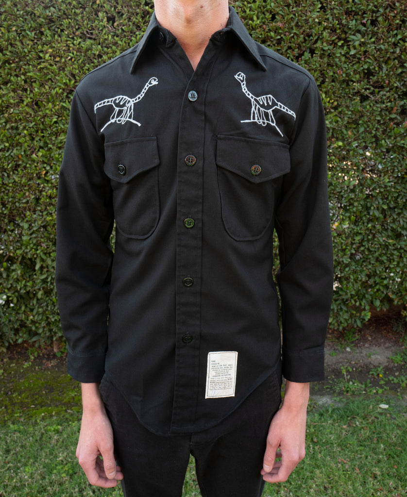 Long sleeve black button up shirt: raptors and spinosaurus